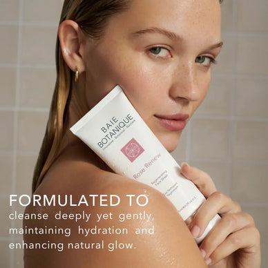Model holding Baie Botanique regenerating rose face wash showing gentle daily cleanser for fresh, balanced skin